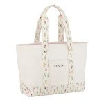 Pure Trade has created three cotton items - spray purse, toiletry bag and shopping bag - with a floral decoration for the Coach Fragrance 2023 collection